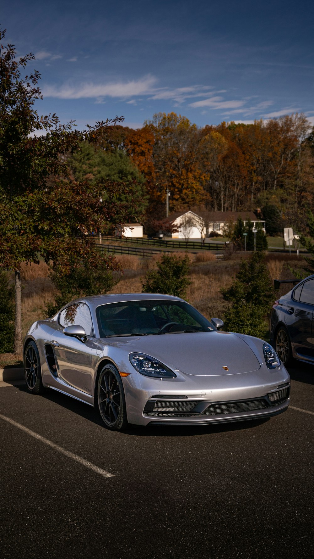 a silver sports car parked in a parking lot