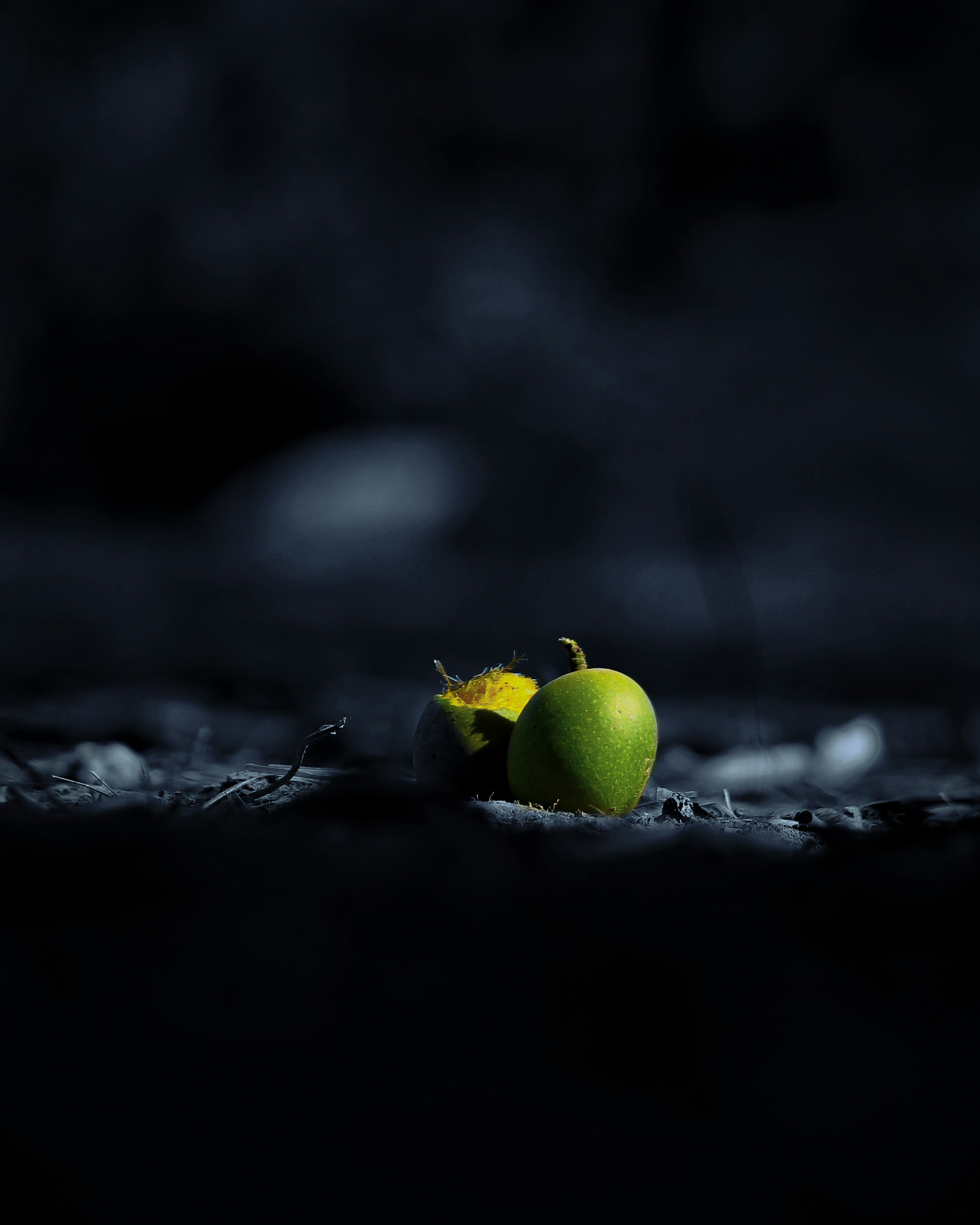 a green apple sitting on top of a table