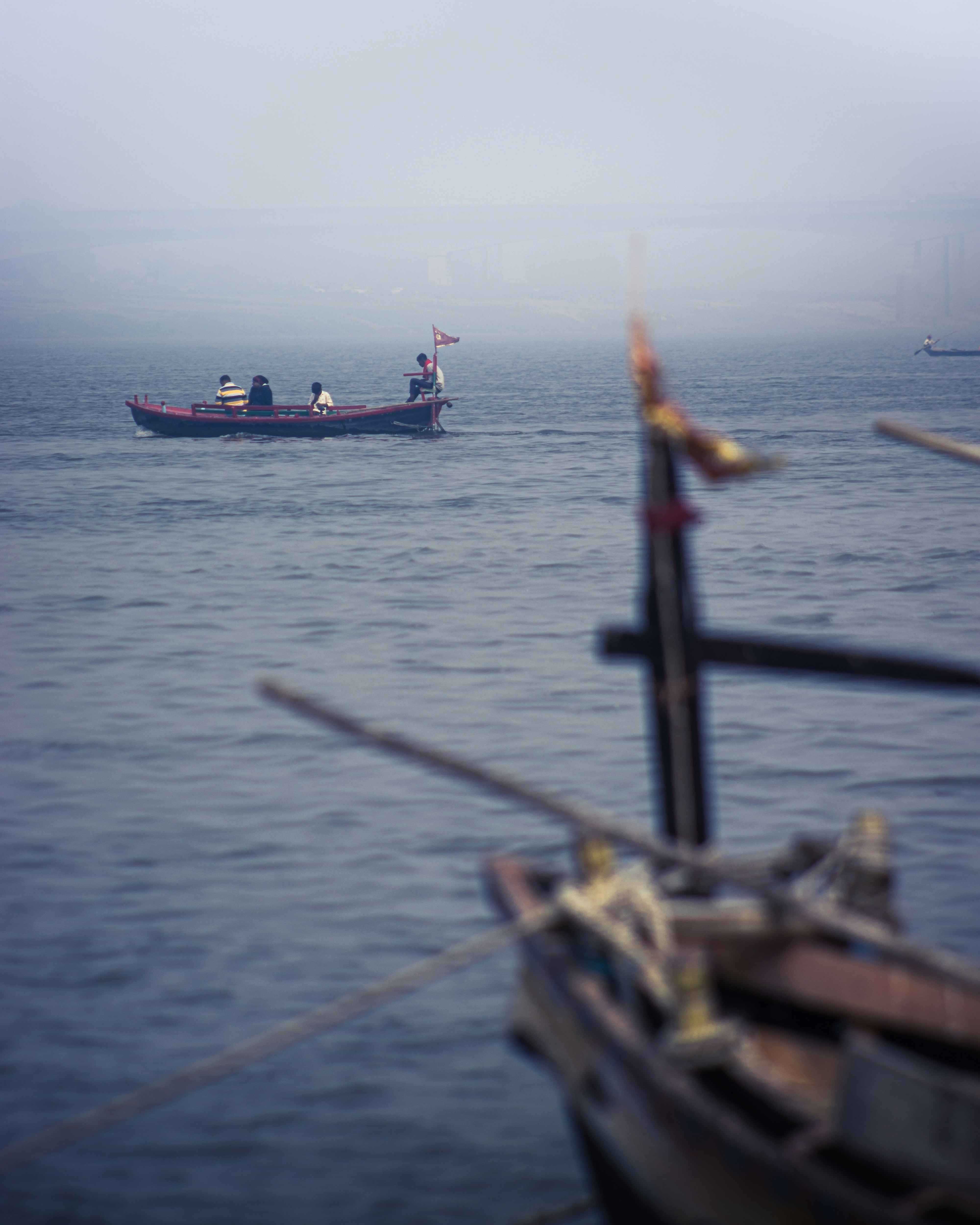 a small boat in the middle of a large body of water