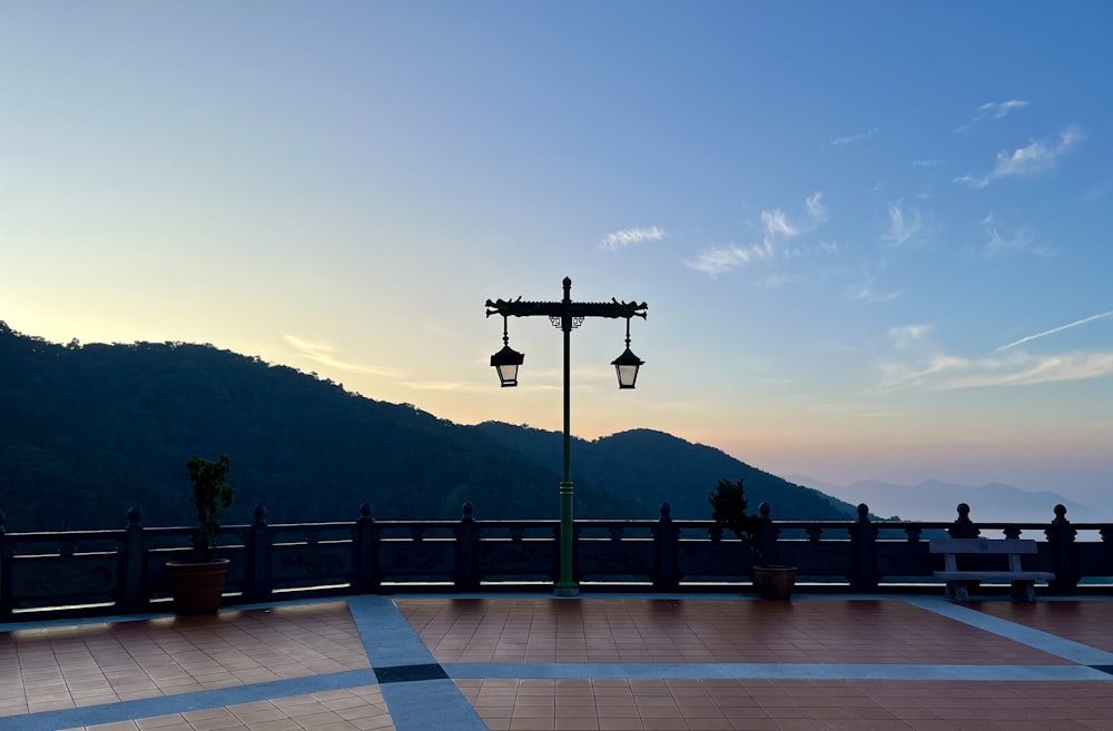 a couple of street lamps sitting on the side of a road