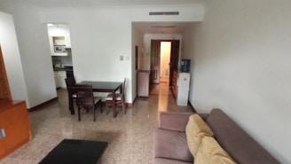 Shared accommodation common area with seating in Burjuman.