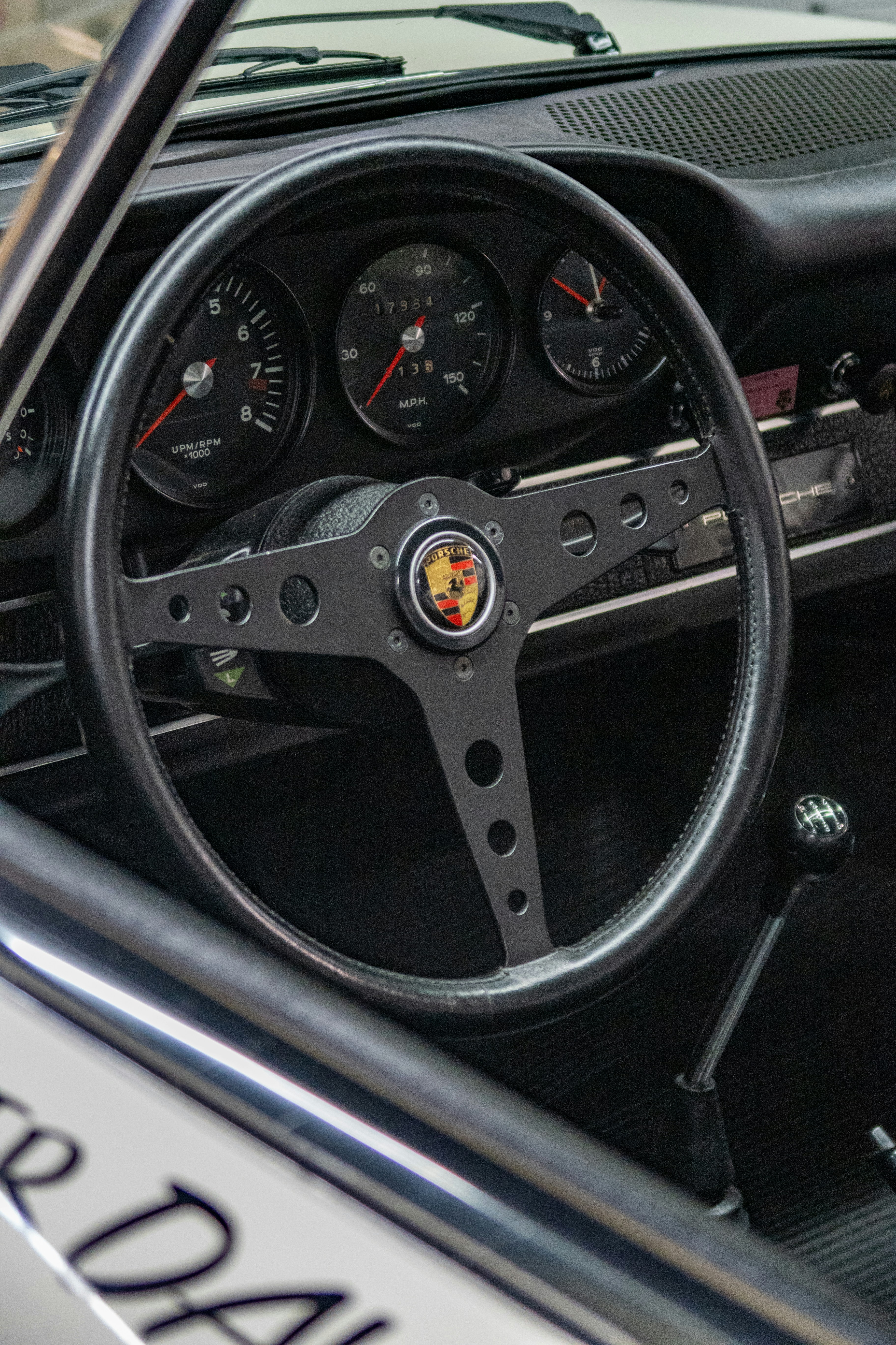 a close up of a steering wheel and dashboard of a car