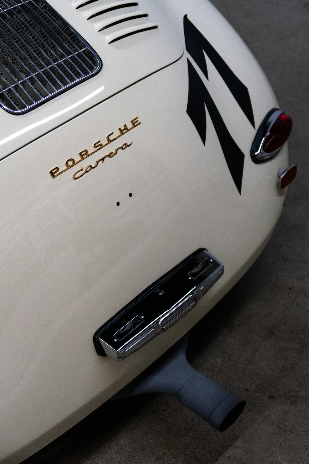 a close up of a white porsche car