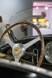 A collection of various steering wheels displayed together.