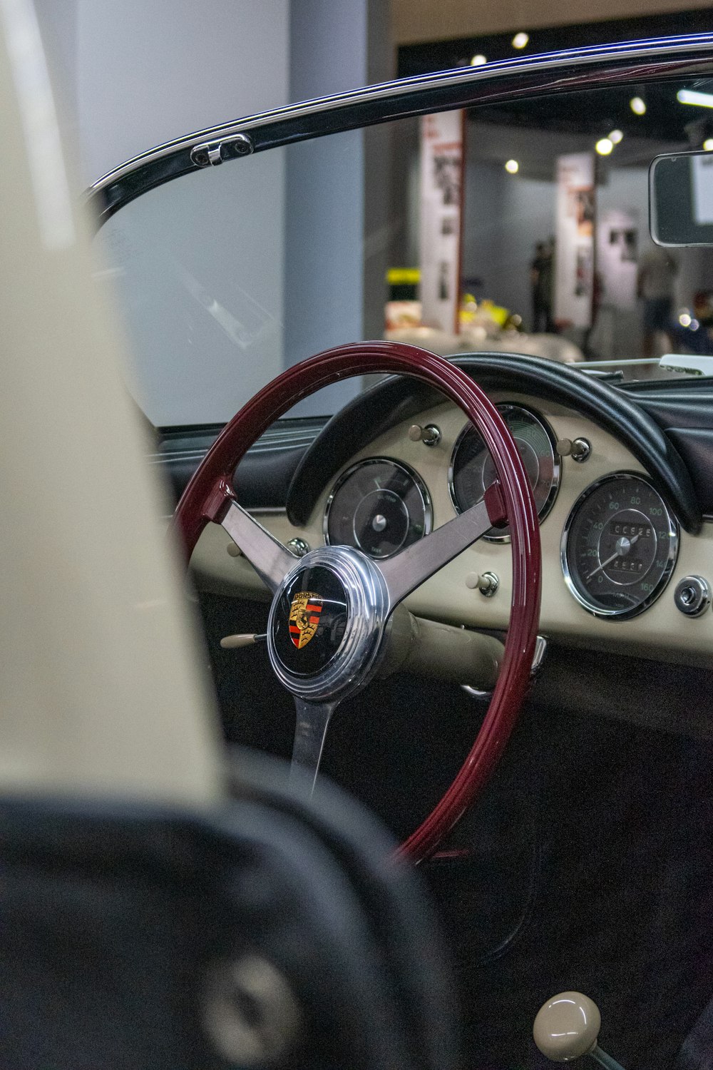 a car dashboard with a steering wheel and gauges