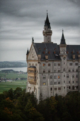 A grand castle under construction with scaffolding and players working together.