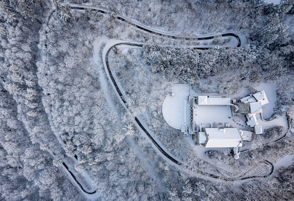 an aerial view of a farm in the snow