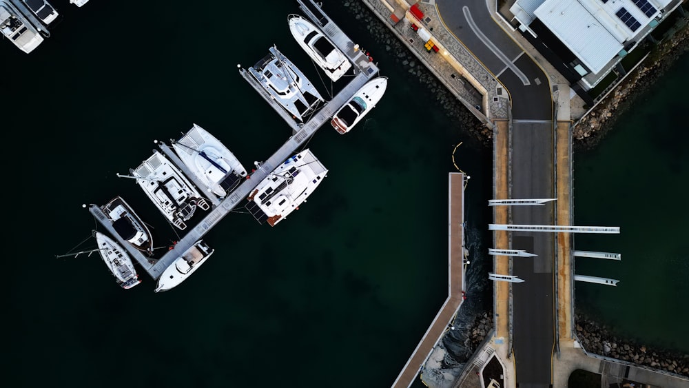 an aerial view of boats docked at a pier