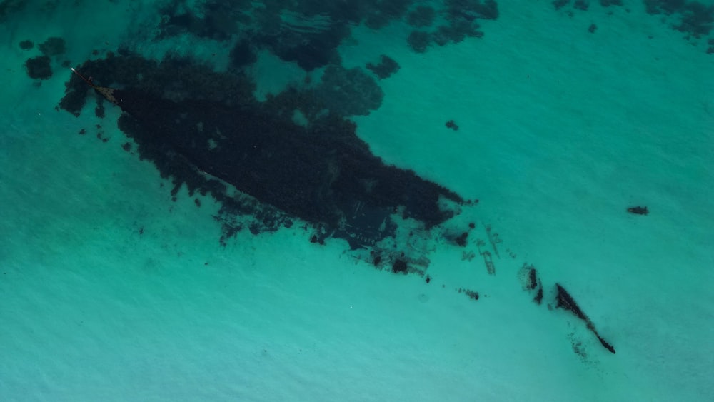 an aerial view of a ship in the water