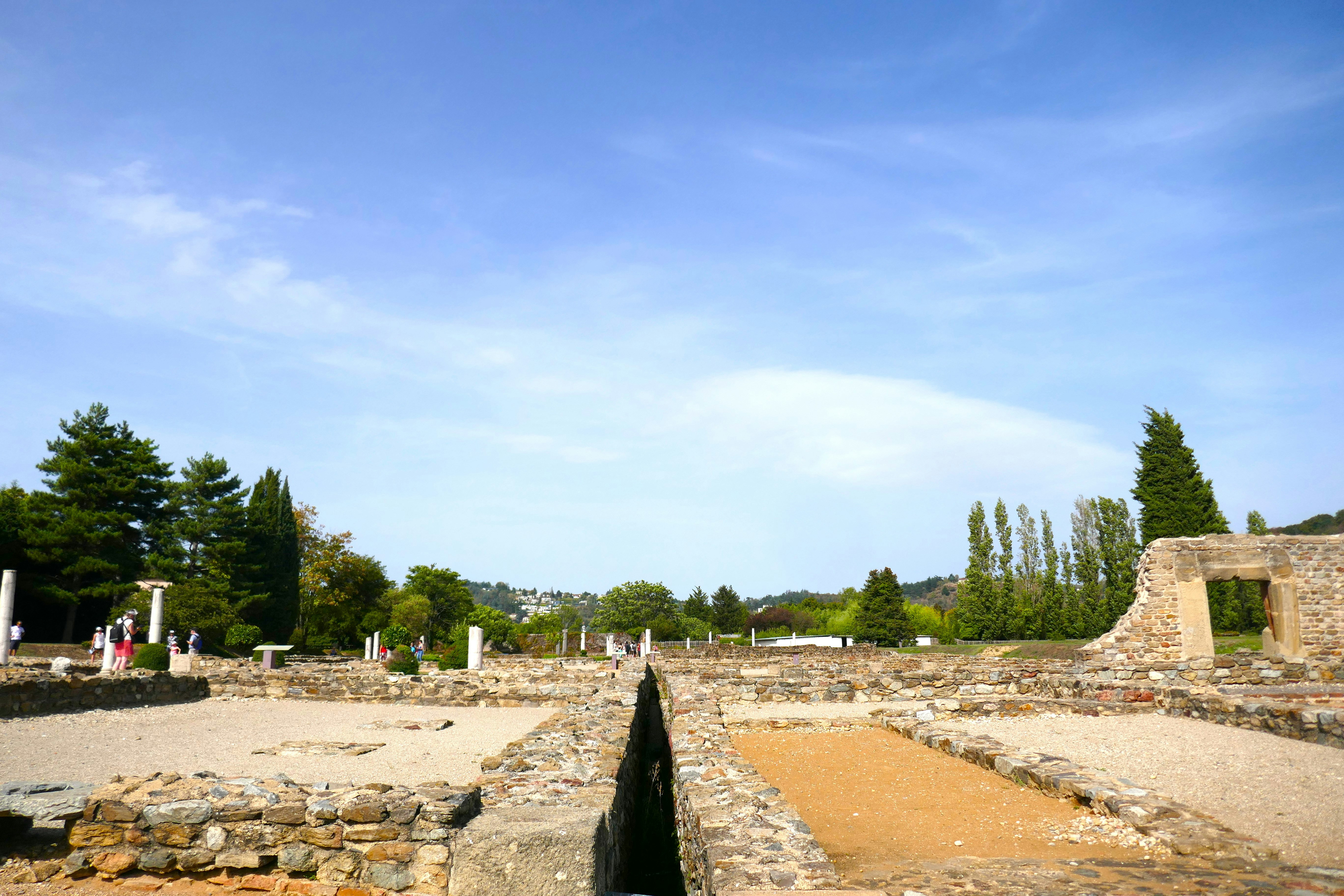 the ruins of a roman city with a sky background