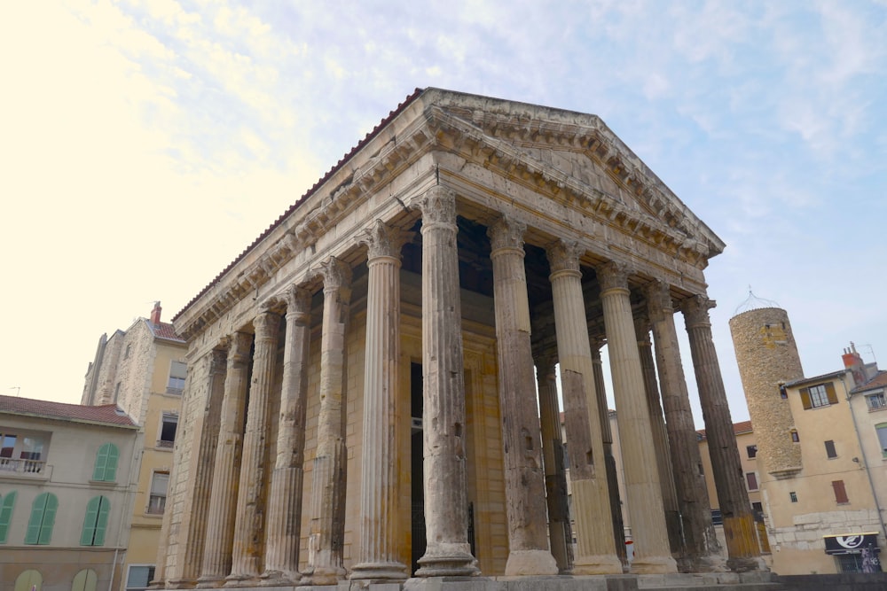 a very tall building with some columns on it