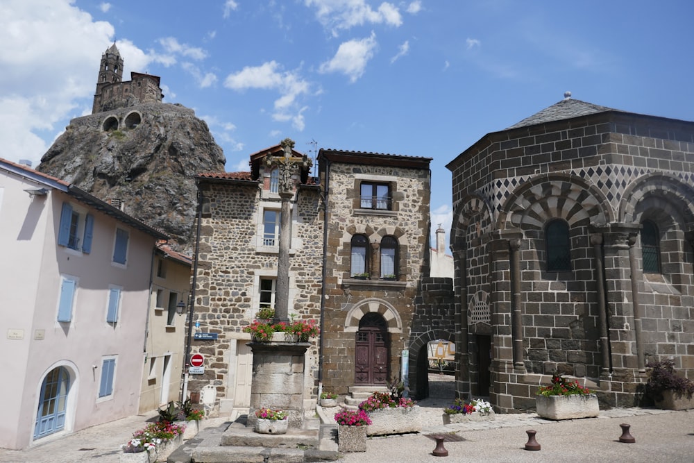 a stone building with a clock tower on top of it