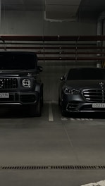 a couple of cars parked in a parking garage
