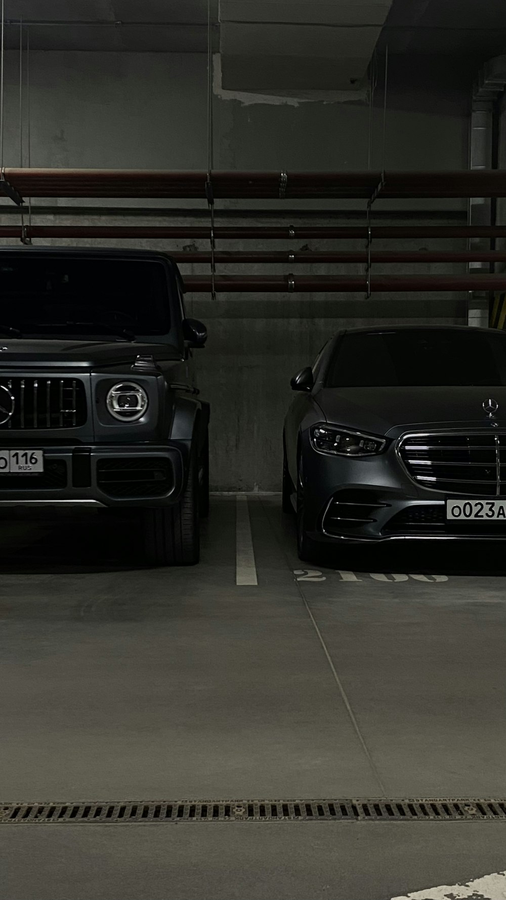 a couple of cars parked in a parking garage