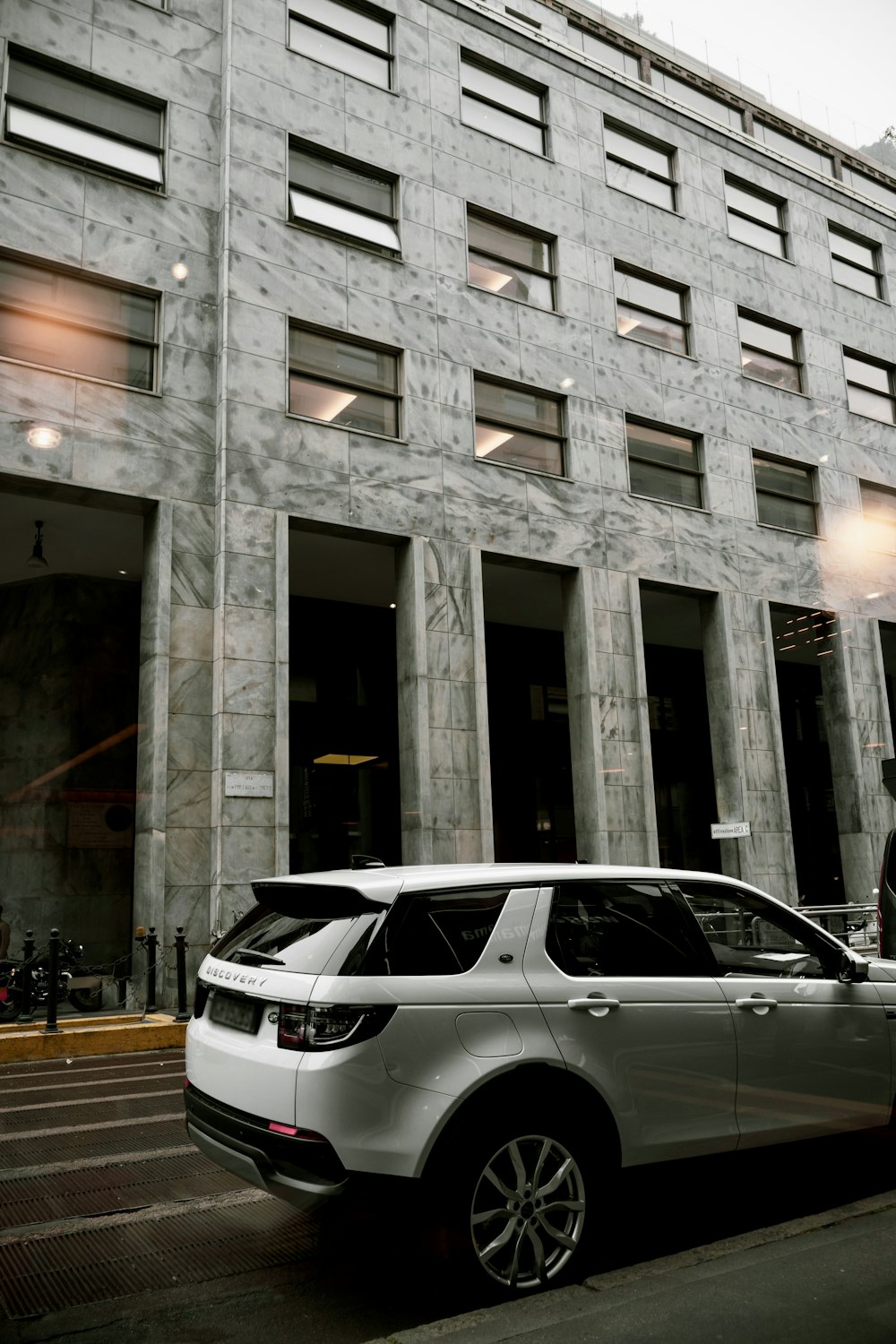 a car is parked in front of a building