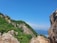 A scenic view of lush greenery and limestone cliffs in Los Haitises National Park.