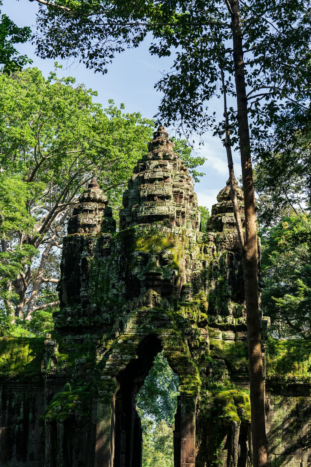 a group of stone structures surrounded by trees
