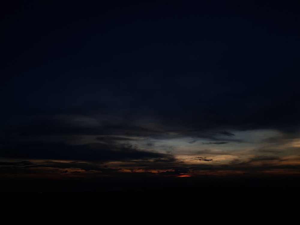 a plane flying in the sky at night