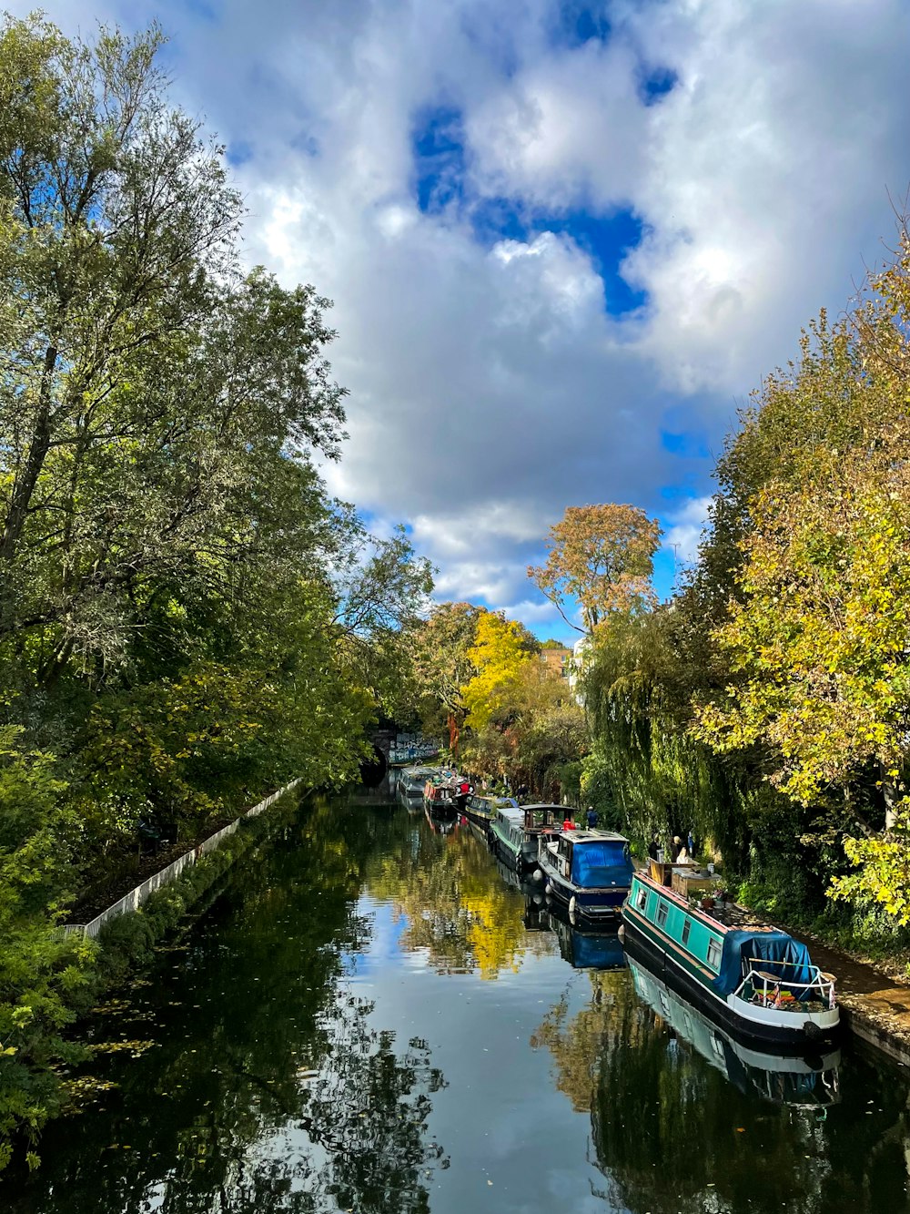 a group of boats floating on top of a river