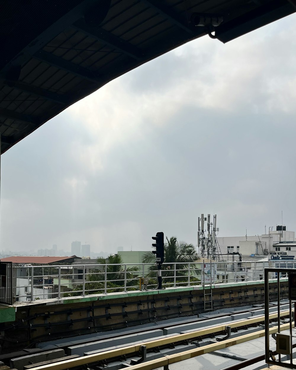 a train station with a train on the tracks