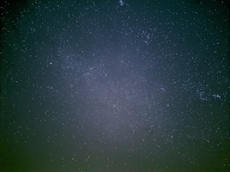 A vast expanse of night sky filled with countless stars, creating a serene and awe-inspiring view of the universe. The tiny specks of light contrast against the dark backdrop, evoking a sense of infinity.