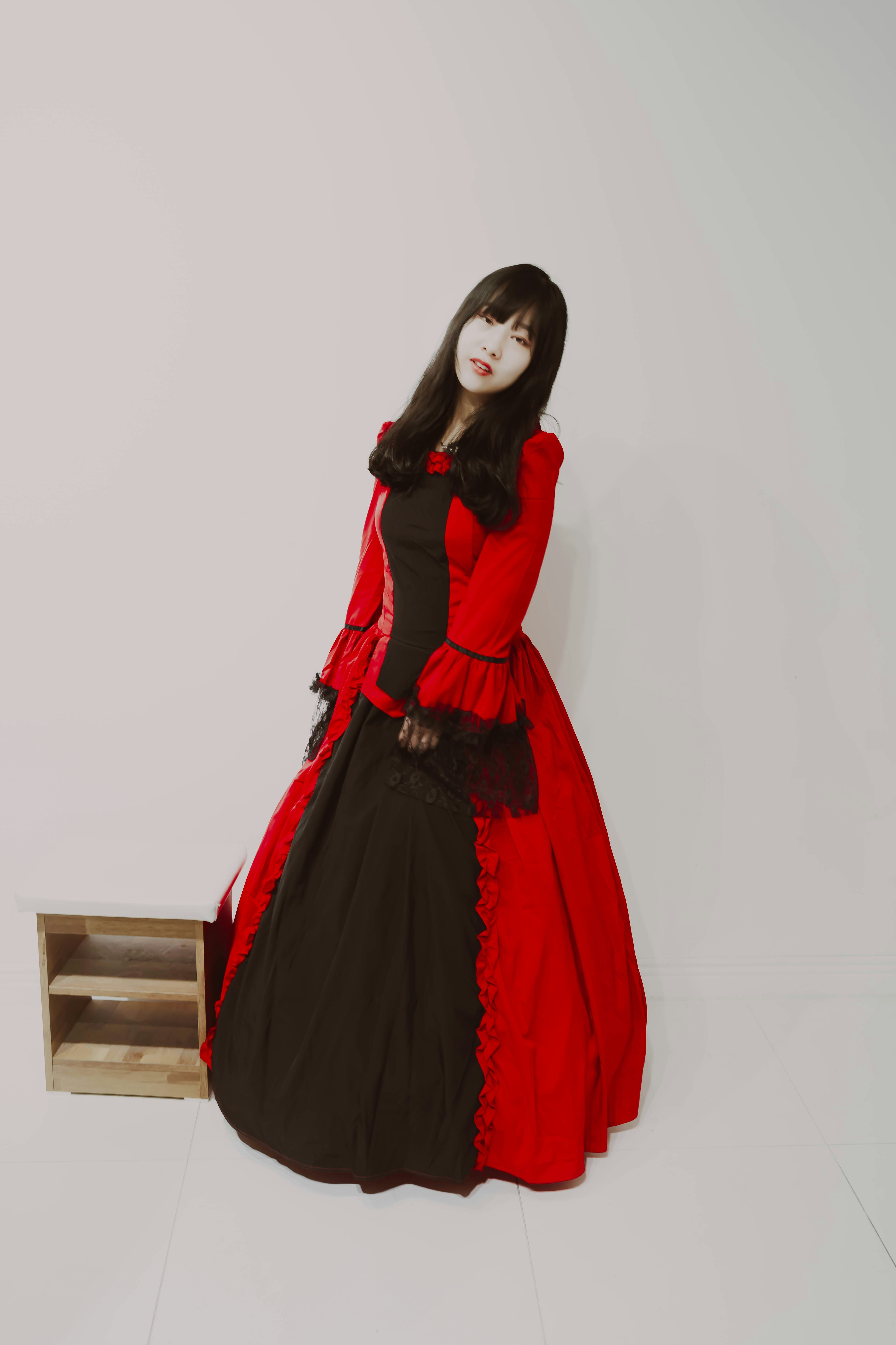 Korean girl in red Victorian gown.
