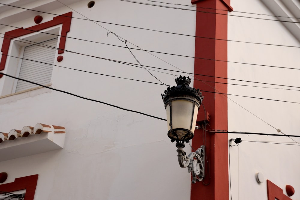 a street light attached to the side of a building