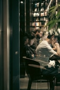 A diverse group of people studying together in a cozy setting.