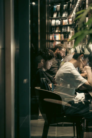 Students studying together at a cozy café in Dublin, with books and laptops open.