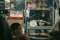 A consultant guiding a business owner through the halal certification process.