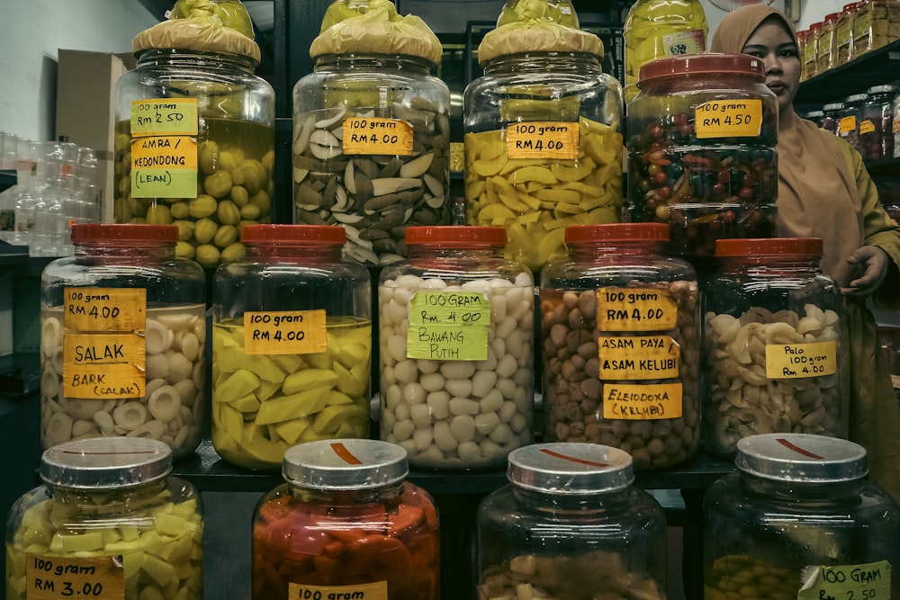 a display of jars filled with different types of food