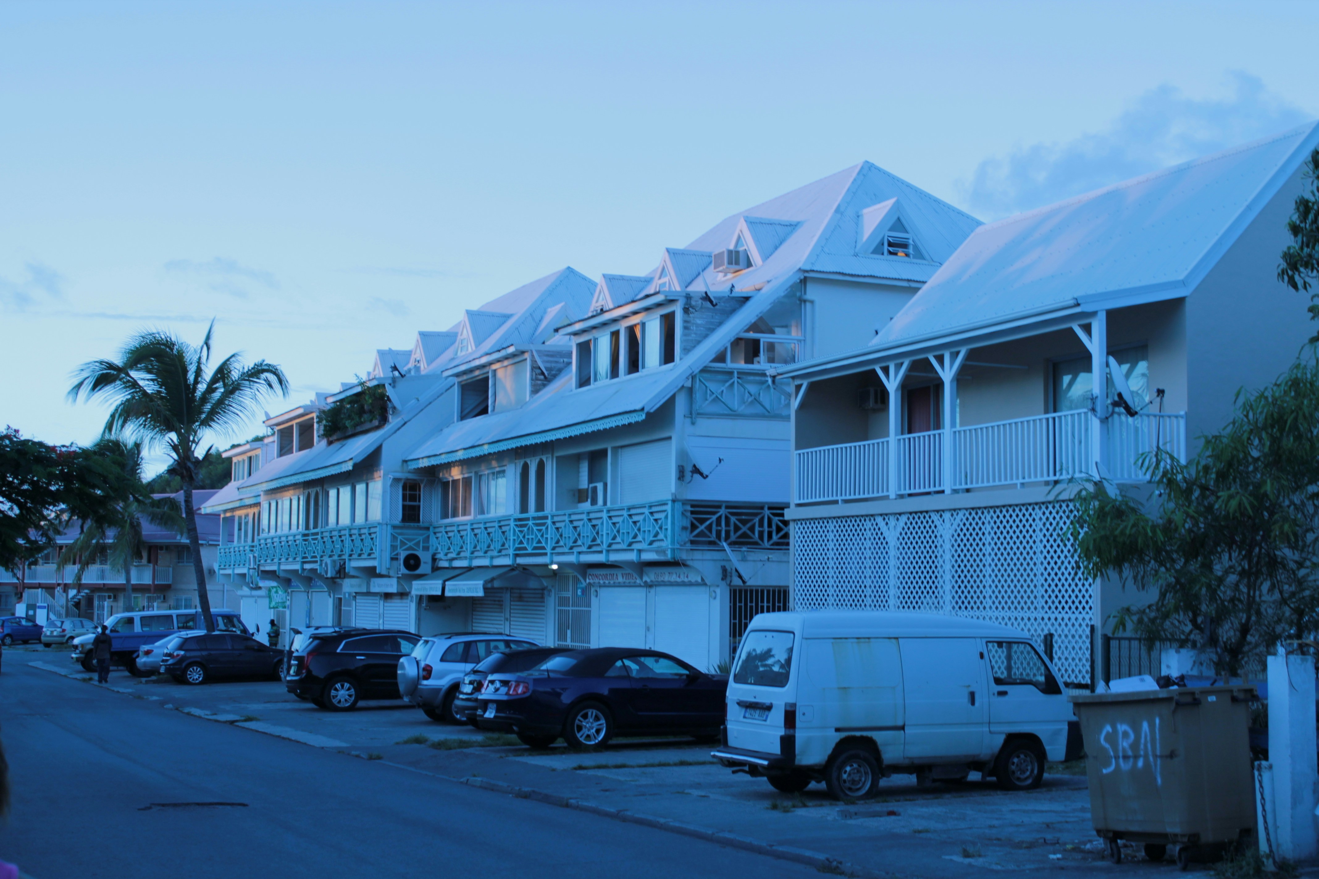 A bunch of cars parked on the side of a road photo Free Sint maarten