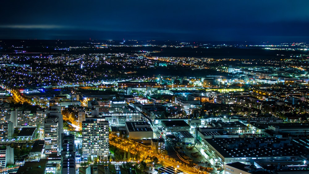 a view of a city at night from the top of a building