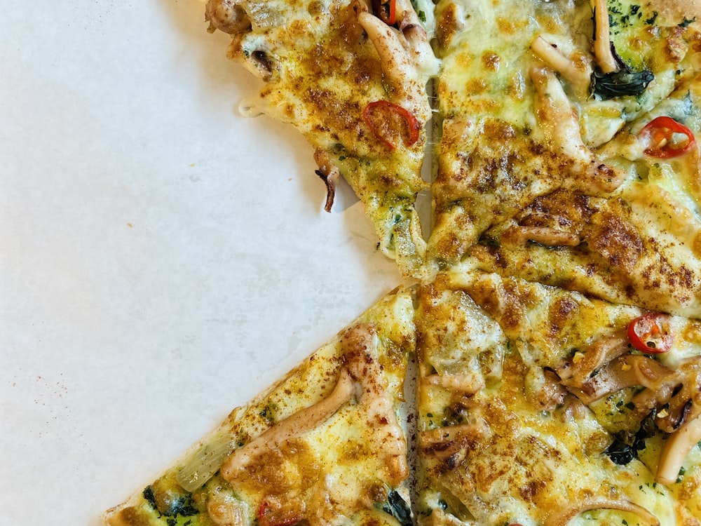 a half eaten pizza sitting on top of a table