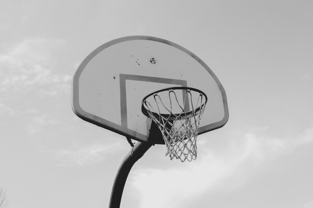 a black and white photo of a basketball hoop