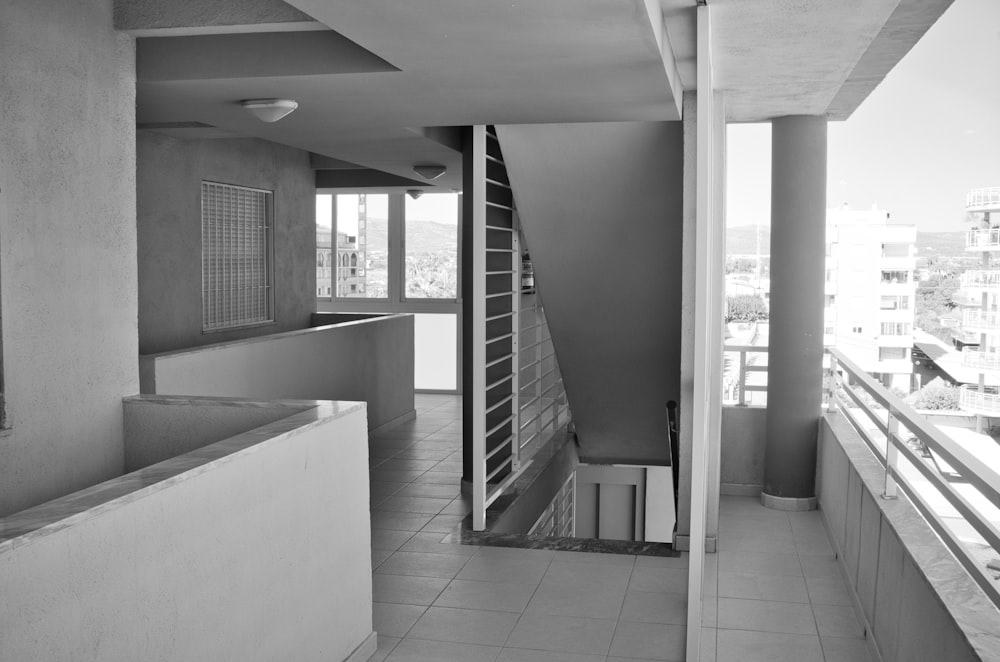 a black and white photo of a balcony