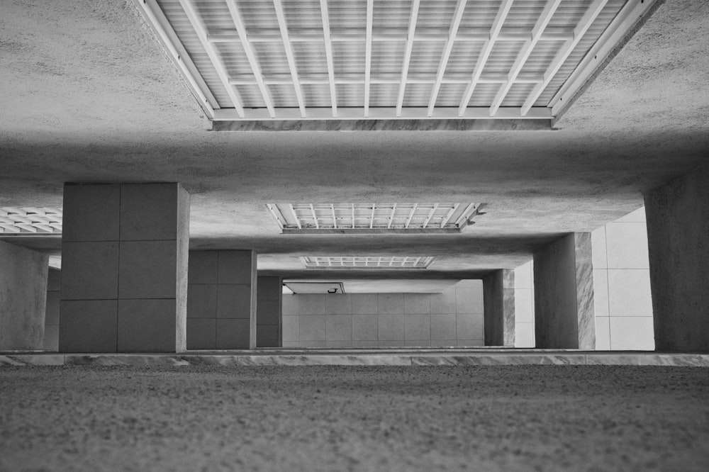 a black and white photo of a parking garage