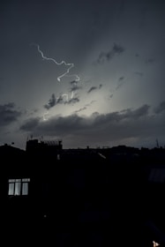 A dramatic cityscape background filled with energy and comic-style lighting.