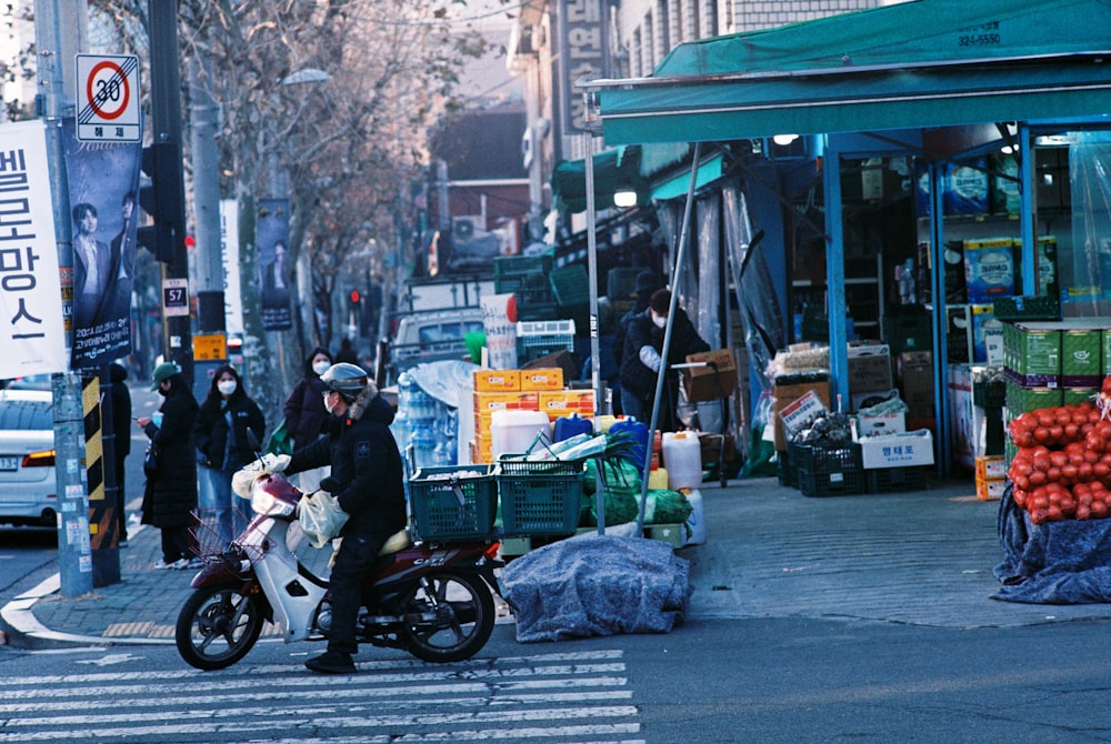 a person on a motorcycle on a city street