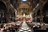 A beautiful church interior filled with worshippers.