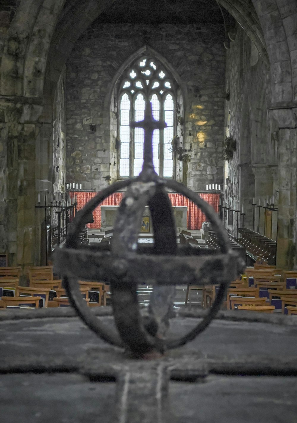 an old church with pews and stained glass windows