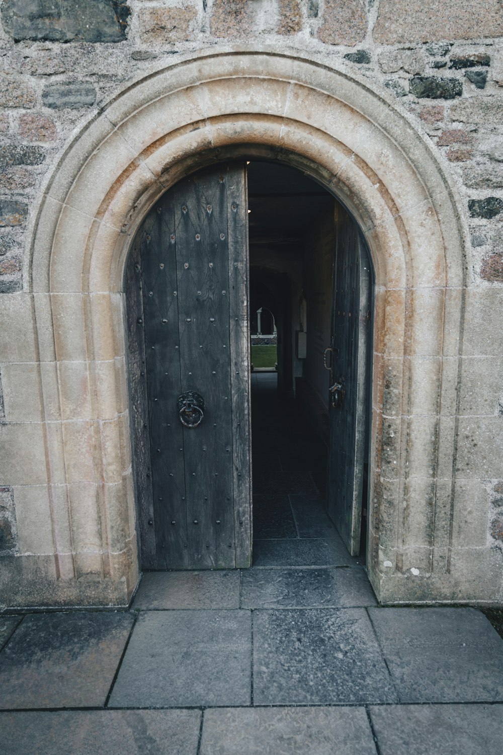 an old stone building with a wooden door