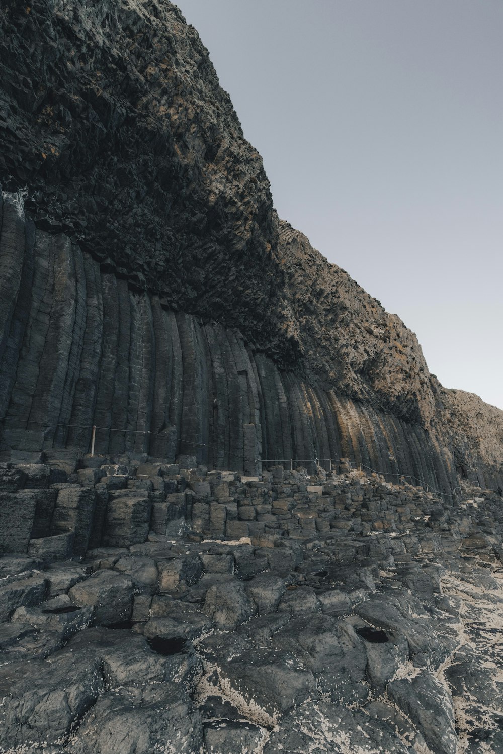 a large rock formation on the side of a mountain