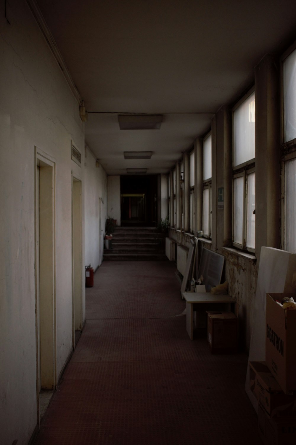 a long hallway with a bunch of windows