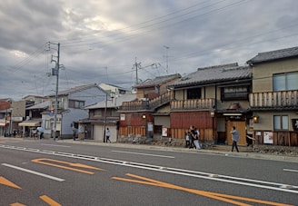 a couple of people are walking down the street