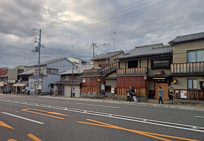 a couple of people are walking down the street