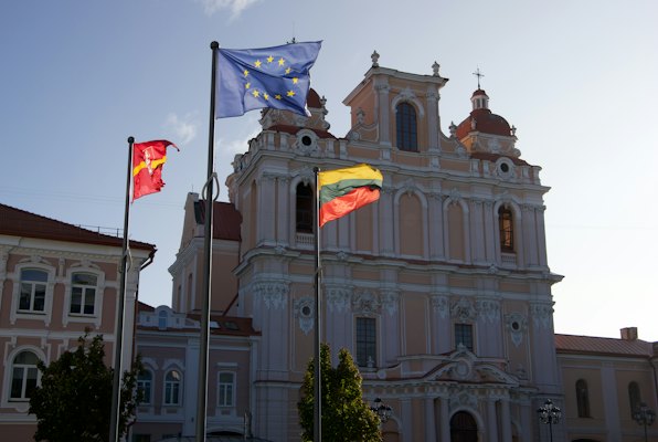 A building with three flags flying in front of it — Vilnius, Lithuania