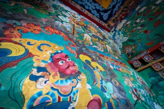 An artistic representation of the amaru symbol in a mural.