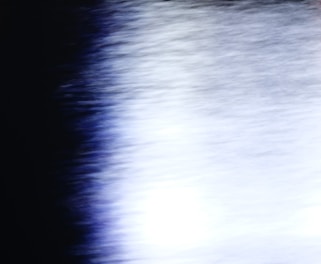 A blurred, dark gradient with subtle light streaks evoking a fading echo.