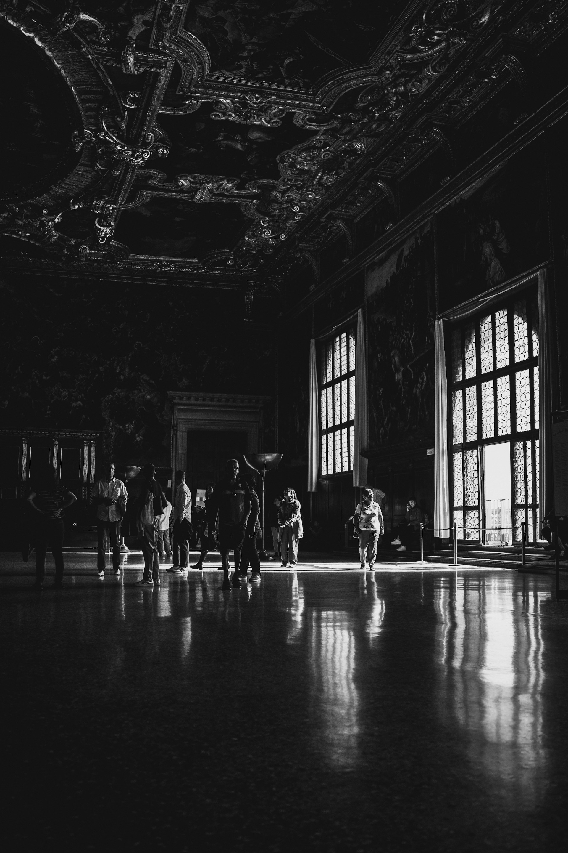a black and white photo of people in a room